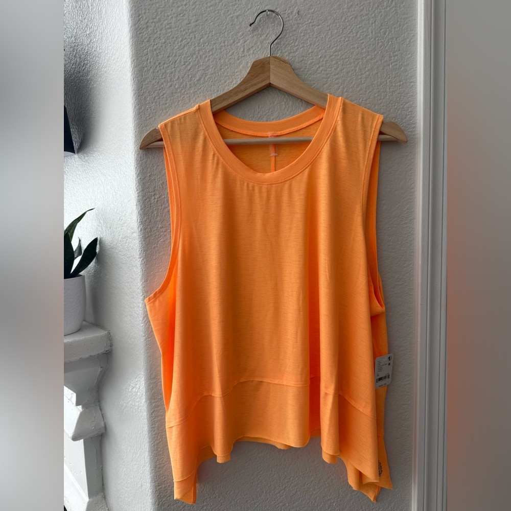 Free People/FP Movement Asymmetrical High-Low Sleeveless Top in Neon Clementine